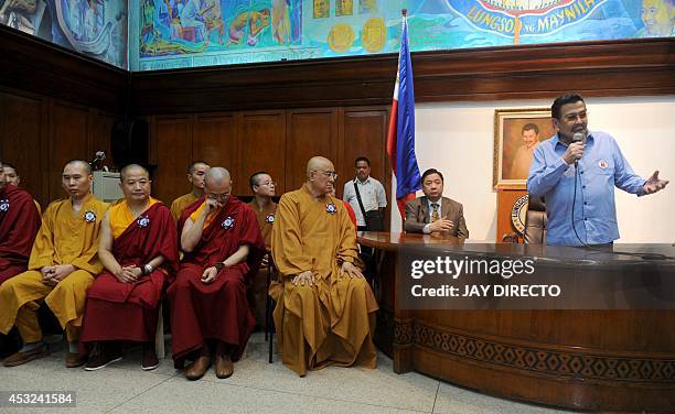 Former Philippine president and now Manila Mayor Joseph Estrada speaks to Buddhist monks from Hong Kong during a courtesy call and a press briefing...