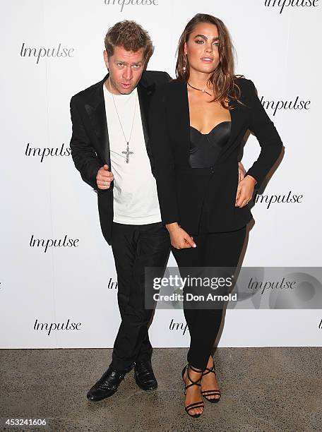 Dan Single and Bambi Northwood Blyth pose for a luxury fragrance launch at Angel & Ash on August 6, 2014 in Sydney, Australia.