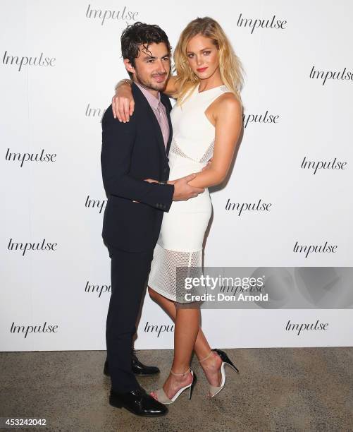 Felix Bloxsom and Erin Heatherton pose for a luxury fragrance launch at Angel & Ash on August 6, 2014 in Sydney, Australia.