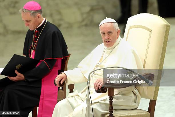 Pope Francis, flanked by Prefect of the Pontifical House and former personal secretary of Pope Benedict XVI, Georg Ganswein, chairs his weekly...