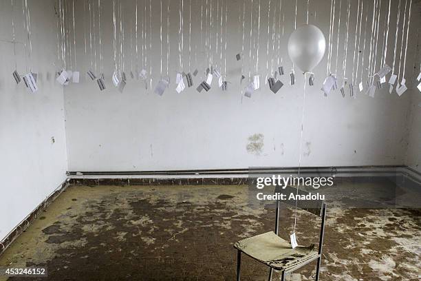 Relatives of the victims, killed in Omarska victims camp, release white balloons with the name of the victims on them during the 22th anniversary of...