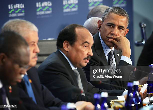 President of Mauritania Mohamed Ould Abdel Aziz speaks as U.S. President Barack Obama listens during a session on "Investing in Africa's Future" of...