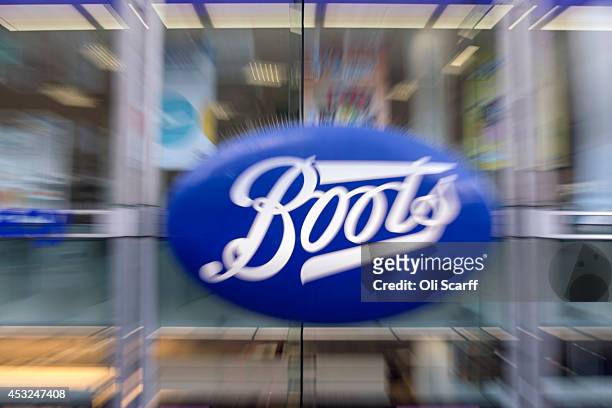 The sign for a branch of Boots the chemist on Oxford Street on August 6, 2014 in London, England. US pharmacy chain 'Walgreens', who previously owned...