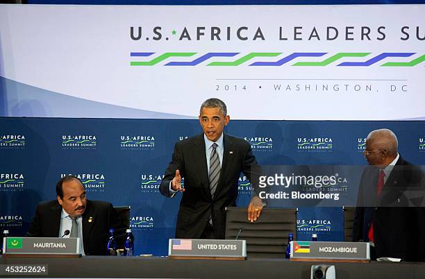 President Barack Obama, center, arrives for a session entitled "Investing in Africa's Future" with Mohamed Ould Abdel Aziz, president of Mauritania,...