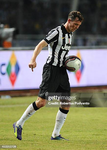 Stephan Lichtsteiner of Juventus FC runs with ball during the pre-season friendly match between Indonesia Selection All Star Team and Juventus FC at...