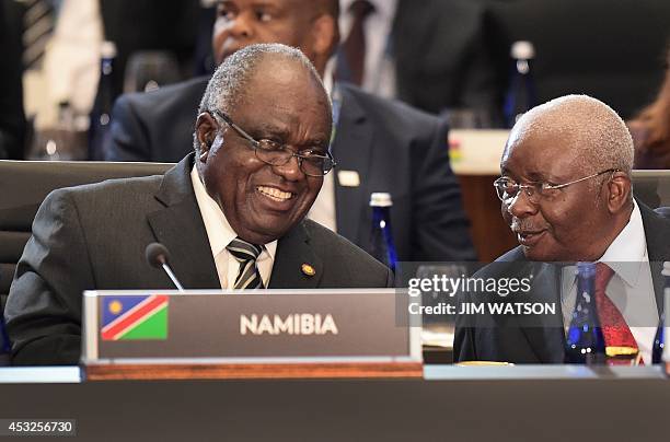 Namibia President Hifikepunye Lucas Pohamba talks with President of Mozambique Armando Guebuza during Session Three: Governing the Next Generation at...