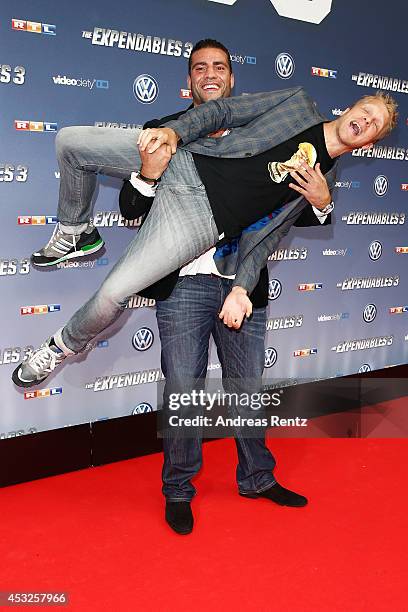 Manuel Charr and Oliver Pocher attend the German premiere of the film 'The Expendables 3' at Residenz Kino on August 6, 2014 in Cologne, Germany.