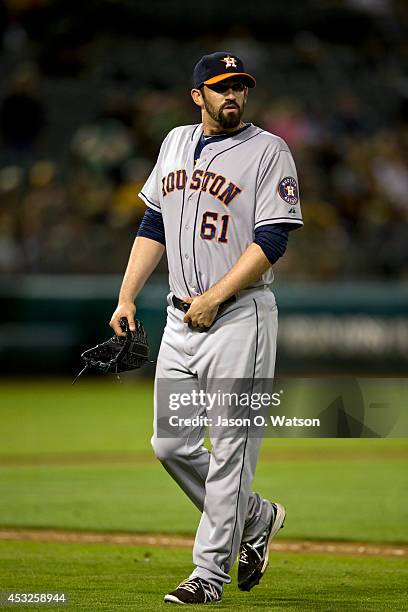 Josh Zeid of the Houston Astros returns to the dugout after being relieved against the Oakland Athletics during the eighth inning at O.co Coliseum on...