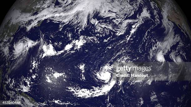 In this handout provided by the National Oceanic and Atmospheric Administration from the GOES-East satellite, four separate weather system Halong,...