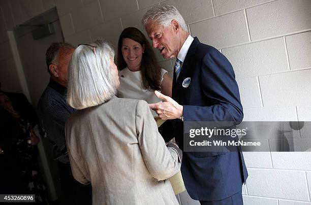 Senate Democratic candidate and Kentucky Secretary of State Alison Lundergan Grimes confers with former U.S. President Bill Clinton and former...
