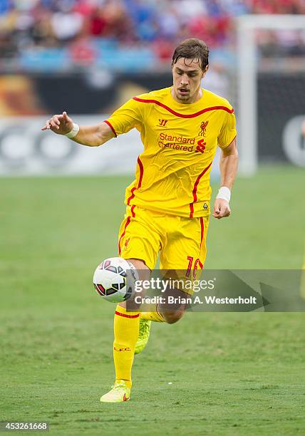 Sebastian Coates of Liverpool passes the ball during first half action against A.C. Milan in the Guinness International Champions Cup at Bank of...