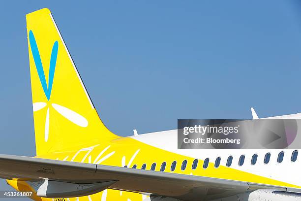 The Vanilla Air logo sits on the tail of the company's first Airbus SAS A320 aircraft during a media preview at Narita Airport in Narita, Chiba...