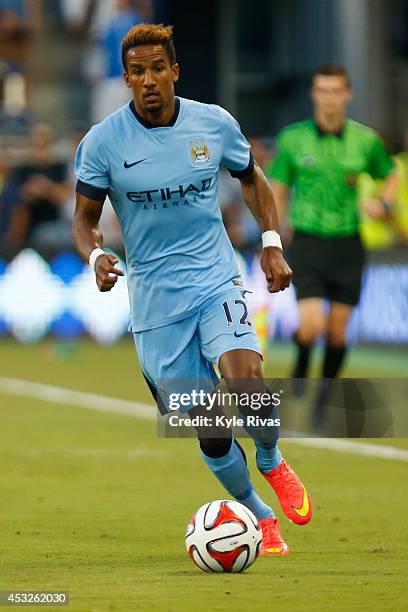 Scott Sinclair of Manchester City drives past the Sporting KC defense late in the firs half on July 23rd at Sporting Park in Kansas City, Kansas.