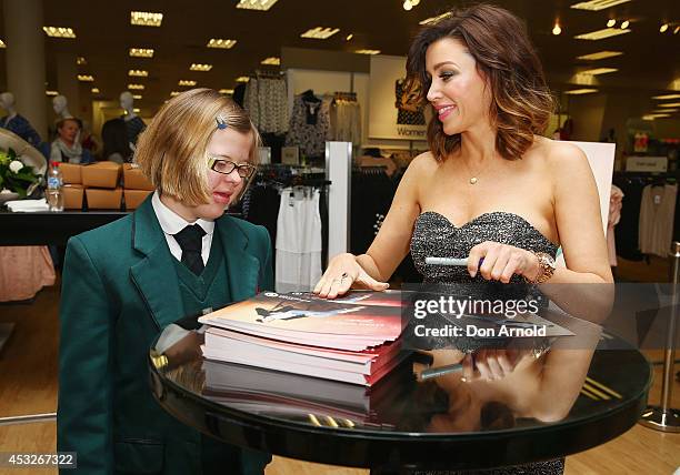 Dannii Minogue poses with fans as she launches her Petites range at Target, Bondi Junction on August 7, 2014 in Sydney, Australia.