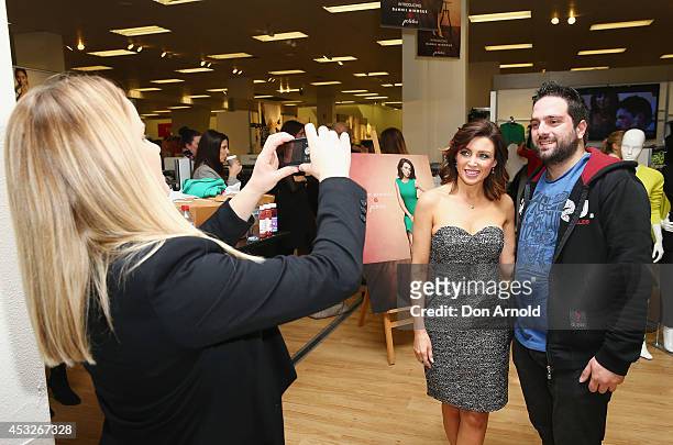 Dannii Minogue poses with fans as she launches her Petites range at Target, Bondi Junction on August 7, 2014 in Sydney, Australia.