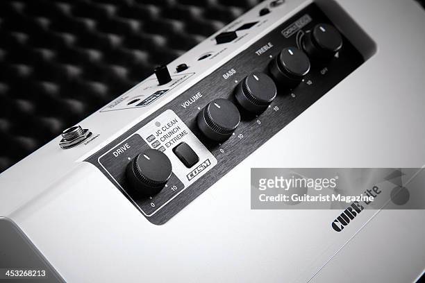 Detail of a Roland CUBE Lite guitar amp and music dock, taken on April 24, 2013.