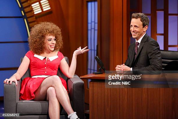 Episode 083 -- Pictured: Michelle Wolf with host Seth Meyers during the "Grown Up Annie" skti on August 5, 2014 --