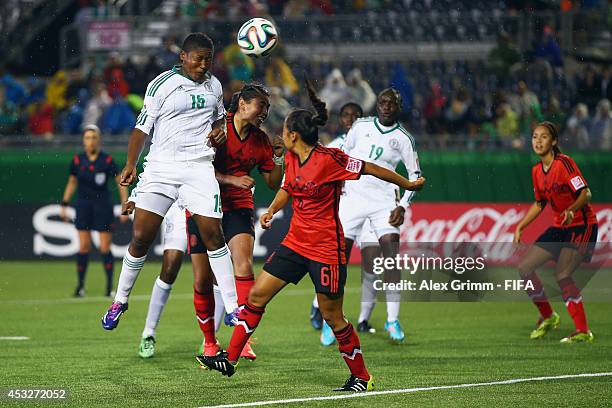 Ugo Njoku of Nigeria tries to score with a header during the FIFA U-20 Women's World Cup Canada 2014 group C match between Mexico and Nigeria at...
