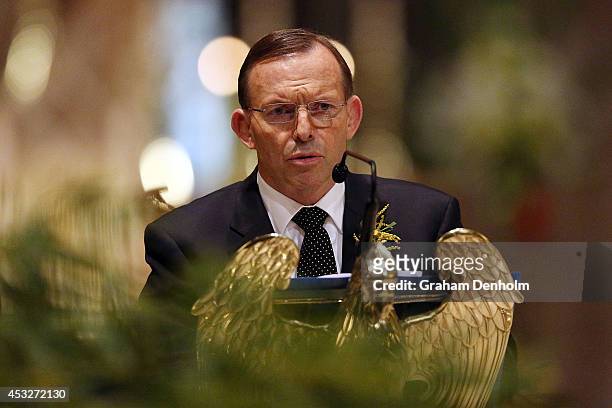 Tony Abbott, Prime Minister of Australia talks during a national memorial service as Australians mourn the loss of all victims of Malaysia Airlines...