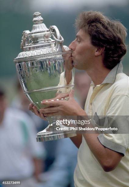 Mike Harwood of Australia kisses the trophy after winning the PGA Championship held at the Wentworth Golf Club, Surrey, 28th May 1990.