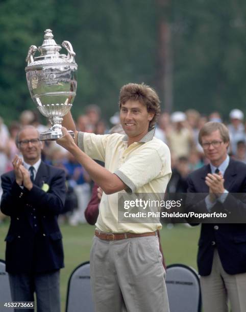 Mike Harwood of Australia with the trophy after winning the PGA Championship held at the Wentworth Golf Club, Surrey, 28th May 1990.