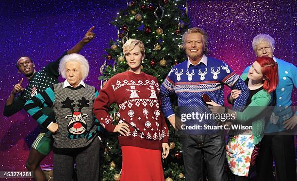 Waxworks of Usain Bolt, Albert Einstein, Kate Winslet, Richard Branson and Boris Johnson are dressed in Christmas jumpers in support of the Save The...