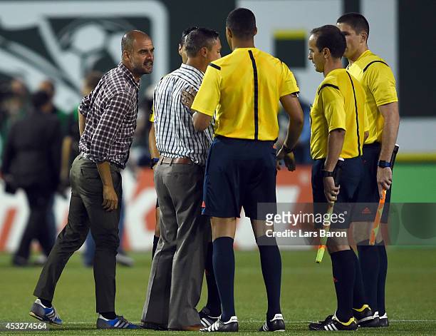 Head coach Josep Guardiola of Muenchen argues with referee Jair Marrufo during the MLS All-Star game between the MLS All-Stars and FC Bayern Muenchen...