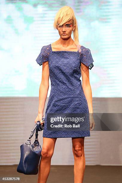 Model on the catwalk for Finish designer 2OR+BYYAT at Copenhagen Fashion Week on August 6, 2014 in Copenhagen, Denmark.