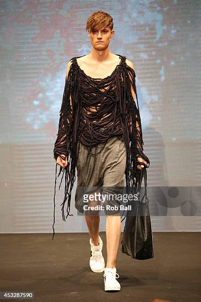 Model on the catwalk for Finish designer 2OR+BYYAT at Copenhagen Fashion Week on August 6, 2014 in Copenhagen, Denmark.