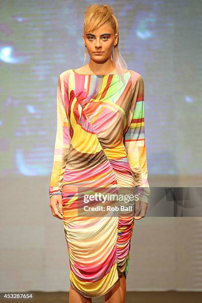 Model on the catwalk for Finish designer 2OR+BYYAT at Copenhagen Fashion Week on August 6, 2014 in Copenhagen, Denmark.