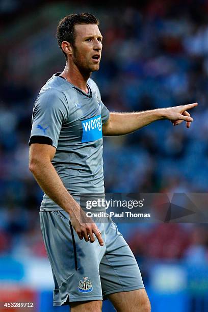 Mike Williamson of Newcastle in action during the Pre Season Friendly match between Huddersfield Town and Newcastle United at the John Smith's...