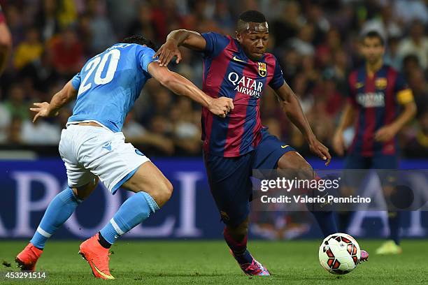 Adama Traore of FC Barcelona is challenged by Blerim Dzemaili of SSC Napoli during the pre-season friendly match between FC Barcelona and SSC Napoli...