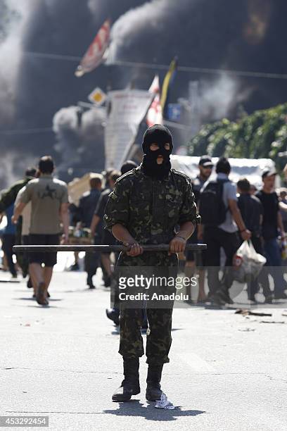 An activist stands guard at Independence Square, also known as the Maidan, during a protest against the local authorities' attempt to clean up the...