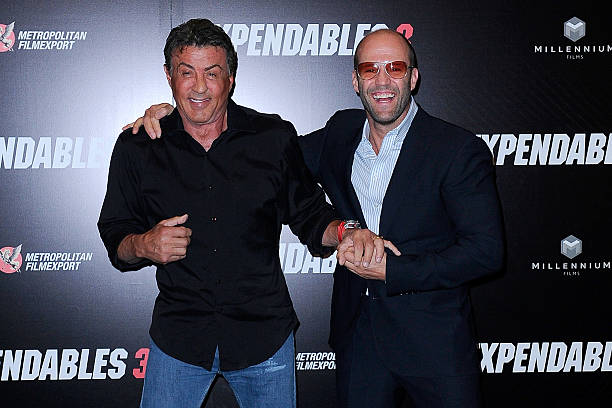 Sylvester Stallone and Jason Statham attend 'The Expendables 3' Paris Photocall at Hotel George V on August 7, 2014 in Paris, France.