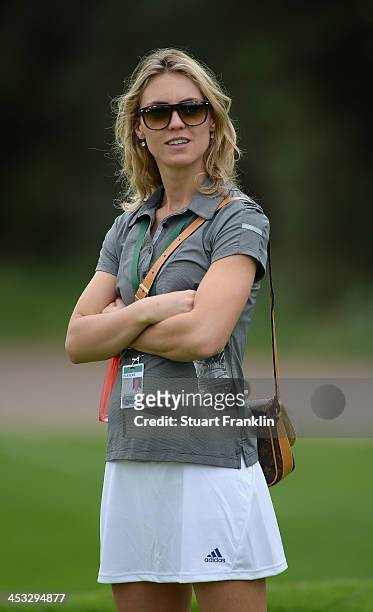 Katharina Boehm watches her friend Sergio Garcia of Spain during the pro - am prior to the start of the Nedban Golf Challenge at Gary Player CC on...