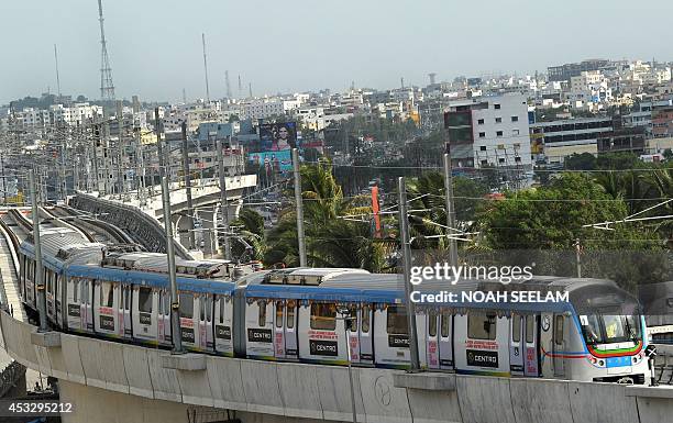 Indian Hyderabad Metro Rail project authorities have a trial run of a metro train on the elevated railway line in Hyderabad on August 7, 2014. The...