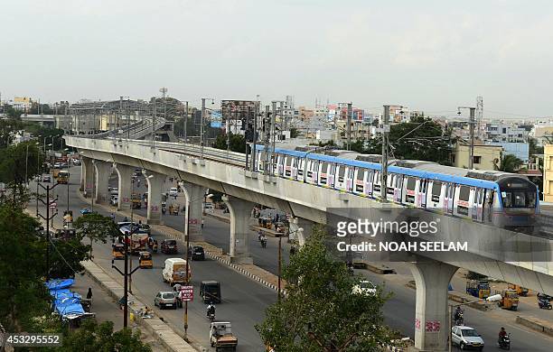 Indian Hyderabad Metro Rail project authorities have a trial run of a metro train on the elevated railway line in Hyderabad on August 7, 2014. The...