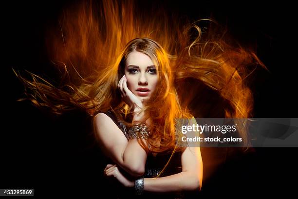 beauty in fire - hot female models stock pictures, royalty-free photos & images