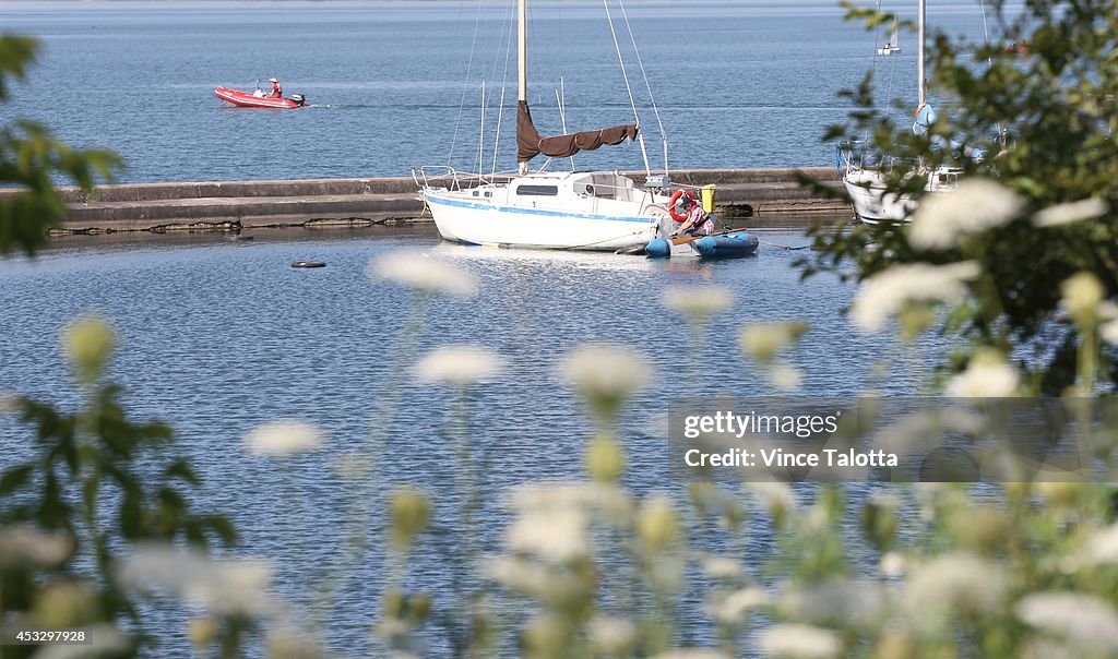 A boater takes to the water at  the Toronto Sailing & Canoe Club at the waterfront on a summer like day