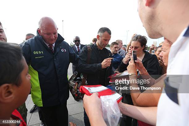 Ryan Giggs is greeted by fans as he arrives before the match between Salford City and the Class of '92 XI at AJ Bell Stadium on August 7, 2014 in...