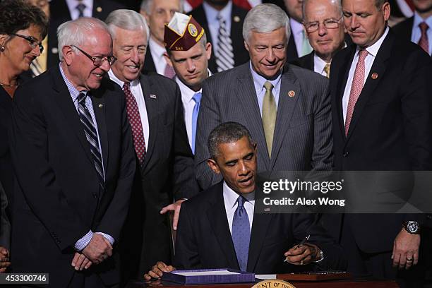 Flanked by congressional members, Rep. Jackie Walorski , Sen. Bernie Sanders , House Minority Whip Rep. Steny Hoyer , Rep. Michael Michaud , and Rep....
