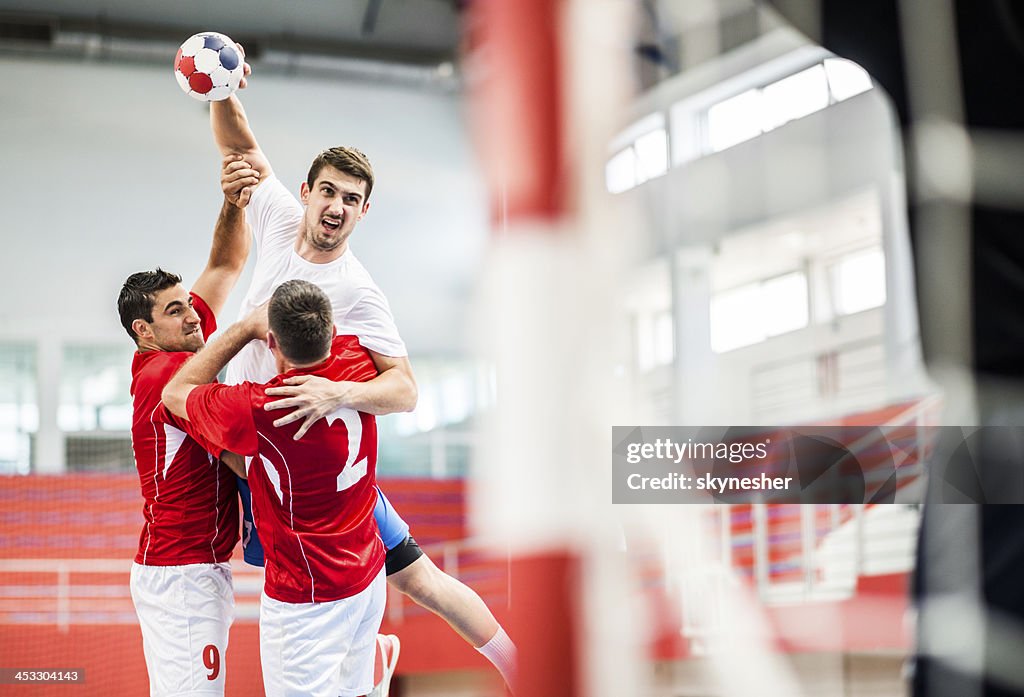 Handball player-shooting at goal.