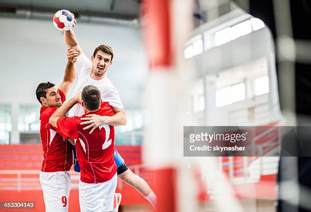 handball player-shooting at goal. - handball championship stock-fotos und bilder