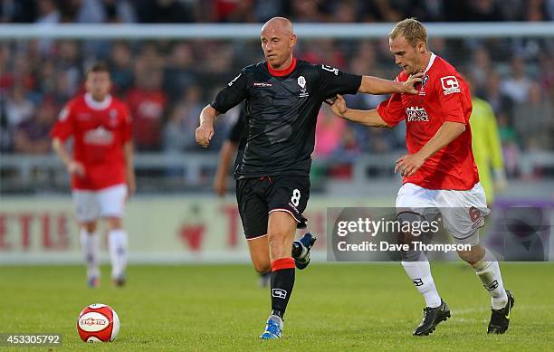 Nicky Butt of the Class of '92 XI gets away from Nicky Platt of Salford City during the match between Salford City and the Class of '92 XI at AJ Bell...