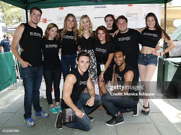 Christine Nagy of 106.7 Lite FM poses for a photo with cast members from Õ50 Shades! The MusicalÕ at 106.7 LITE FM's Broadway in Bryant Park 2014 at...