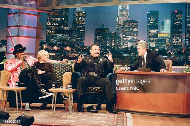 Episode 1232 -- Pictured: Basketball player Dennis Rodman, comedian Ellen DeGeneres, and police officer Vinnie Bazain during an interview with host...