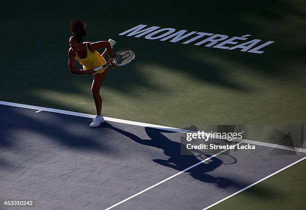 Jelena Jankovic of Serbia serves to Coco Vandeweghe of the USA during the Rogers Cup at Uniprix Stadium on August 7, 2014 in Montreal, Canada.