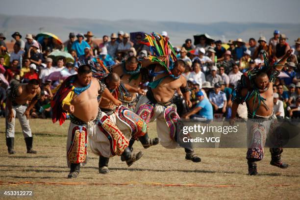 Wrestlers compete during the annual Naadam festival on July 29, 2014 in Xilinhot, Inner Mongolia Autonomous Region of China. Around 768 people...