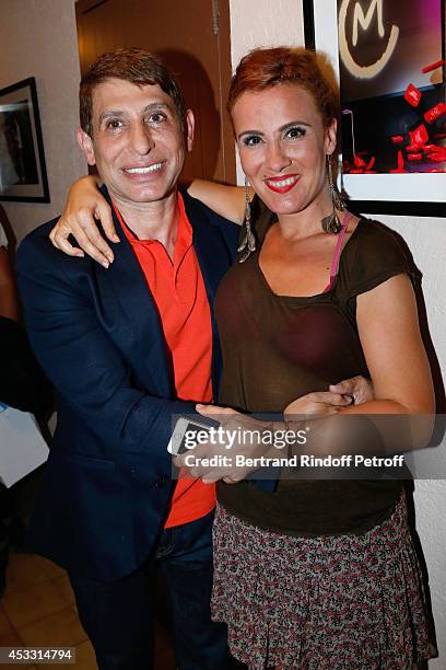 Jacques Dermi and actress Noemie de Lattre pose backstage after "Le fils du comique" play at the 30th Ramatuelle Festival : Day 7 on August 7, 2014...