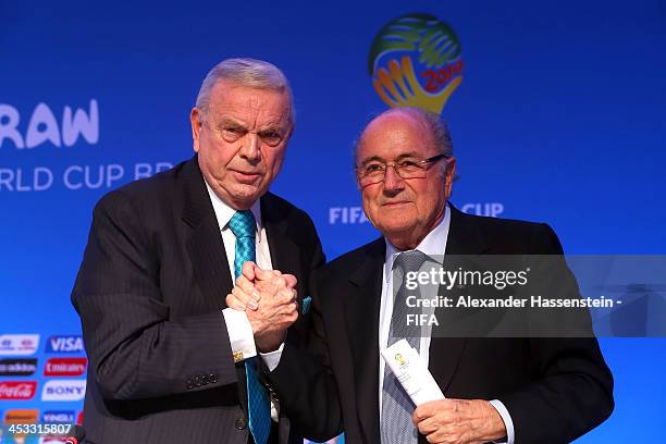 President Joseph S. Blatter talks to Jose Maria Marin President of the Brazilian Football Confederation and President of the Local Organizing...